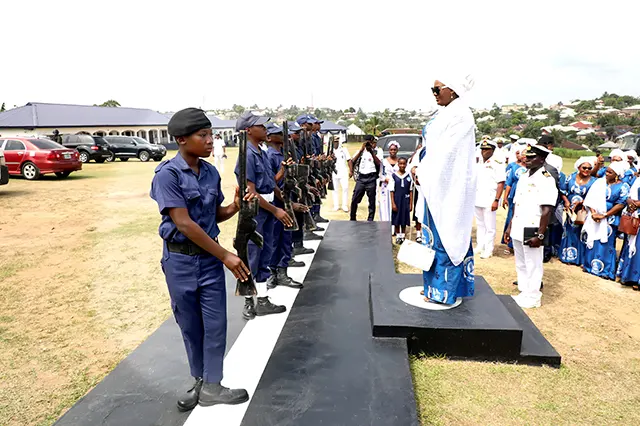 The immediate past President of NOWA, Hajiya Nana Aisha Gambo receiving a salute at the Quarter Guard mounted in her honour by the students of NOWA Secondary School, Atimbo, Calabar