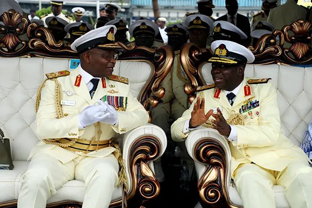 Immediate past CNS Having a Conversation with the New CNS, Rear Admiral Emmanuel Ogalla at the Pulling Out Ceremony of Vice Admiral AZ Gambo