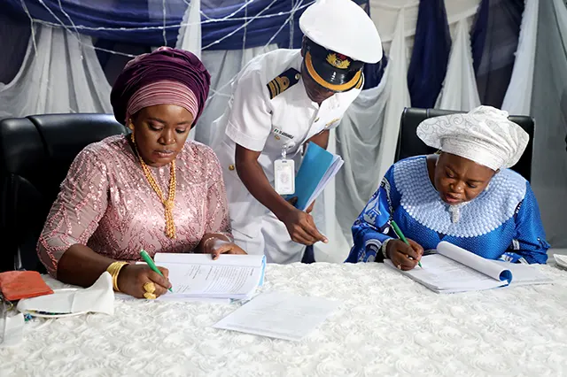New NOWA National President, Mrs. Ijeoma Ogalla and the immediate past President, Hajiya (Dr.) Aisha Nana Gambo Signing Handover Notes